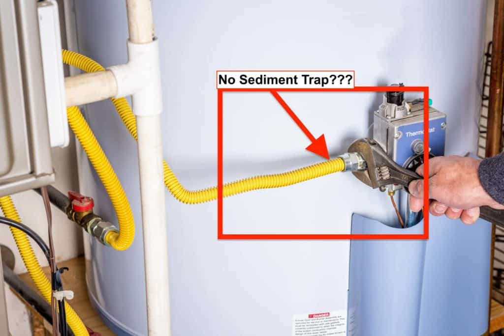 Missing a sediment trap on the water heater.