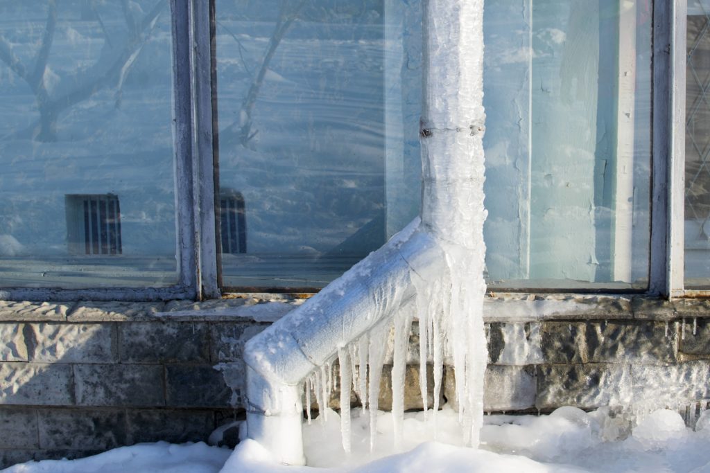 Frozen downspout on a house