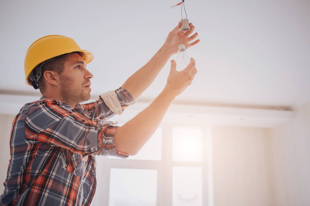 Electrician checking out the light bulb.