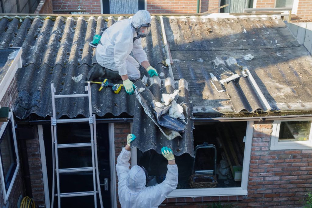 Asbestos removal companies taking precautions. This is not part of the home inspection.