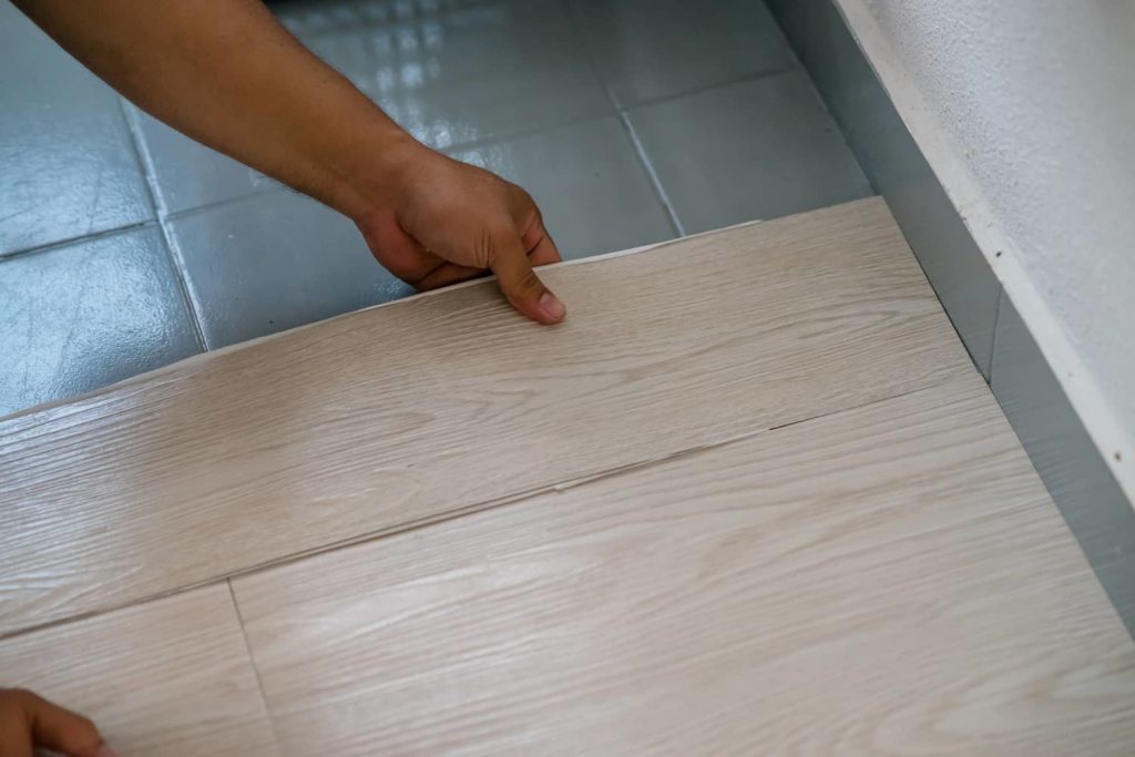 Vinyl floor over tile is another way to add this flooring to your room. 