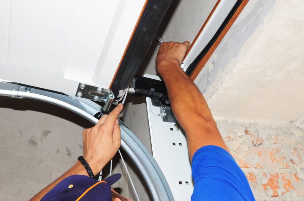 Repair a garage door torsion springs on a garage door.