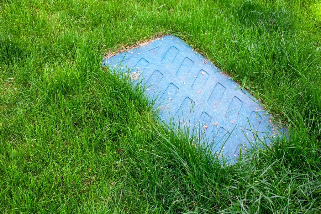 Locate your septic tank to begin working to unclog your septic tank drain pipe.